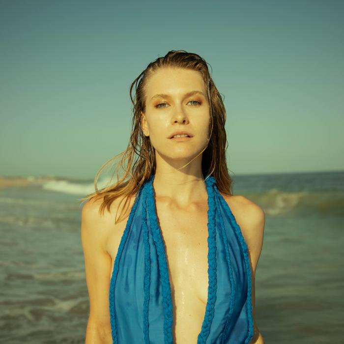 Close-up of Caucasian model with wet hair on the beach photographed by Marty Gottlieb
